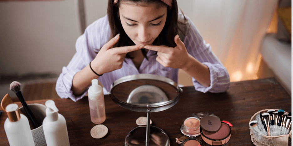 Woman doing her daily morning makeup routine