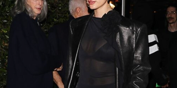 Hailey Bieber in short shier mesh dress with full makeup glam